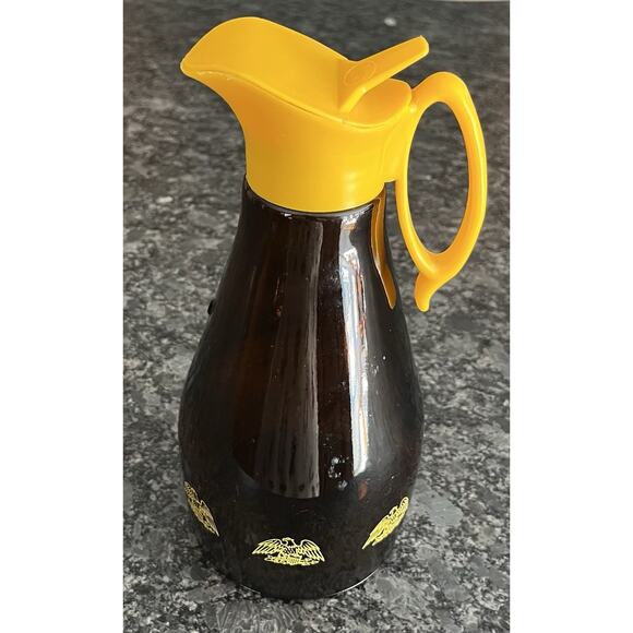 Vintage 1970s Amber LOG CABIN Syrup Dispenser Glass Bottle Yellow Eagle & Top - Picture 1 of 10